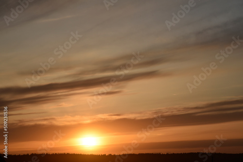Evening sunset and sun with clouds and horizon © Lushchikov Valeriy