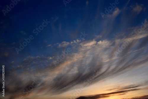 Evening sunset sky with blue and yellow clouds