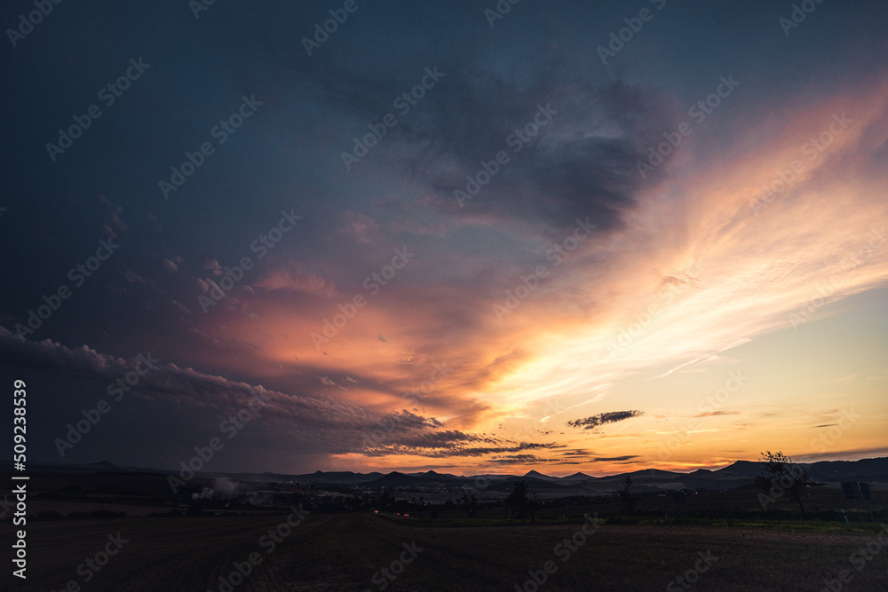 Colorful dramatic sky with cloud and sunset, Czech republic, Ceske stredohori