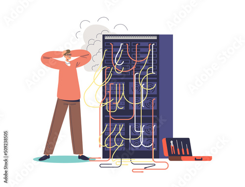 Worried man sysadmin look at burning computer server. System administrator engineer fixing network