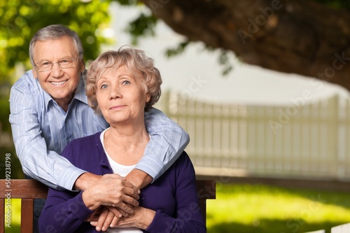 Portrait of happy elderly couple together, take care and love with good relationship, in the park © BillionPhotos.com