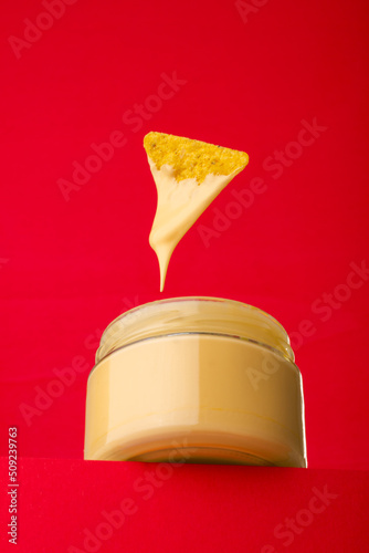 Canvas Print Tasty nacho with spicy cheese sauce