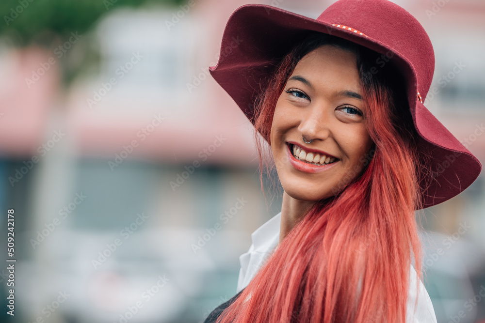 portrait of smiling redhead girl in hat outdoors on the street portrait of smiling redhead girl in hat outdoors on the street