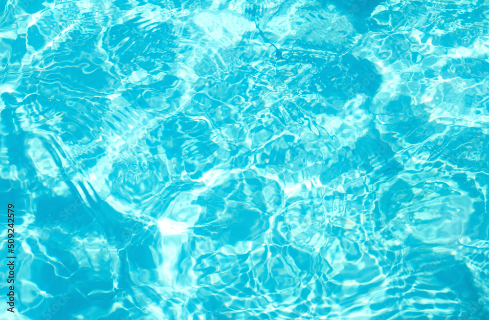 Fototapeta premium Surface of blue transparent water in the pool