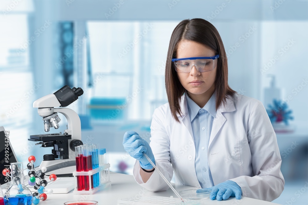 Female young Scientist Working in The Lab Female young Scientist Working in The Lab
