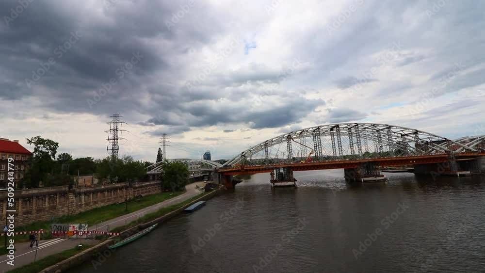 The Vistula River that runs through the middle of the city of Krakow in Poland and the bridge over it, top view The Vistula River that runs through the middle of the city of Krakow in Poland and the bridge over it, top view