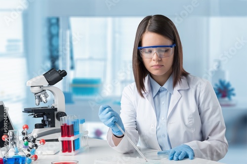 Female young Scientist Working in The Lab