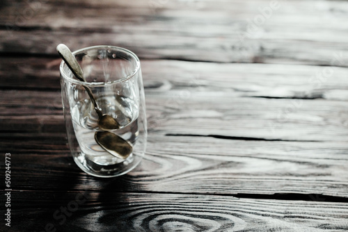 Glass of water on a wooden background