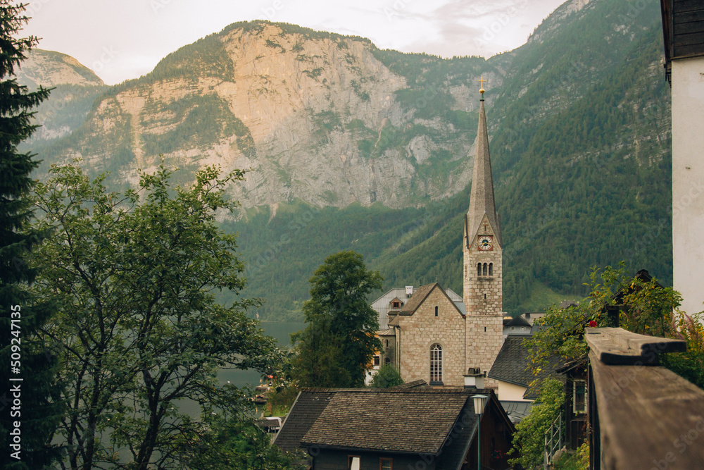 photograph of the main church of hallstatt austria with a view towards the lake