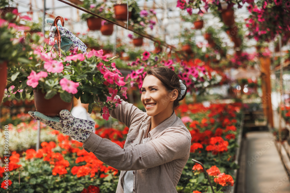 Florists Women Working With Flowers In A Greenhouse