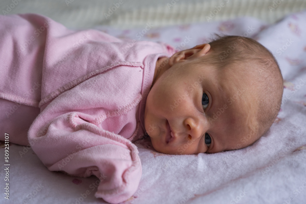Portrait of caucasian cute little infant girl. healthy one month baby Portrait of caucasian cute little infant girl. healthy one month baby