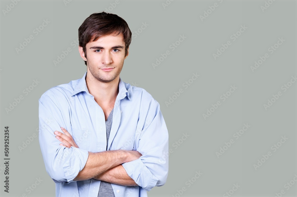 Portrait of smiling mature man standing and posing on background. Portrait of smiling mature man standing and posing on background.