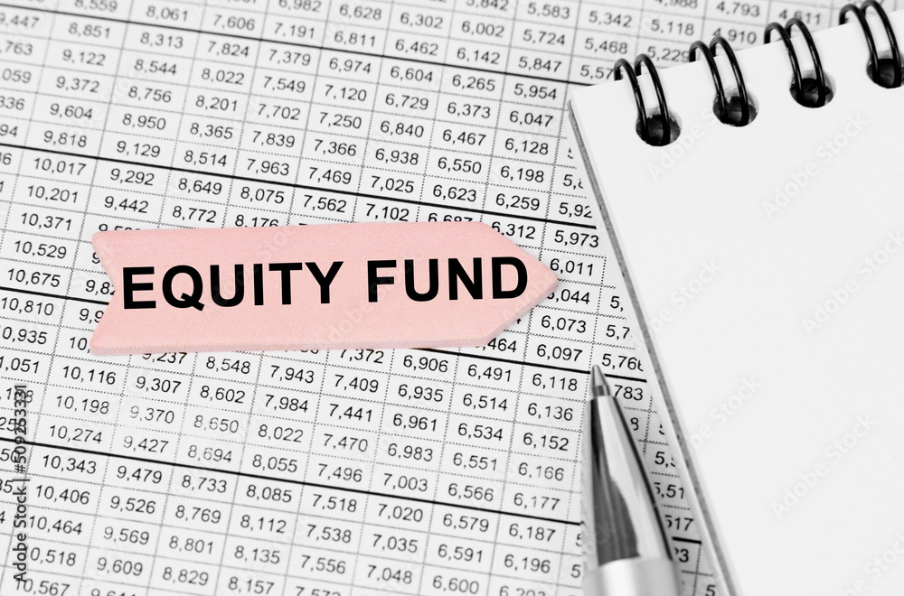 On the table among the reports is a notebook, a pen with an arrow with the inscription - EQUITY FUND
