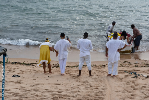 Candomble members delivering gifts to Iemanja, the queen of the sea. photo
