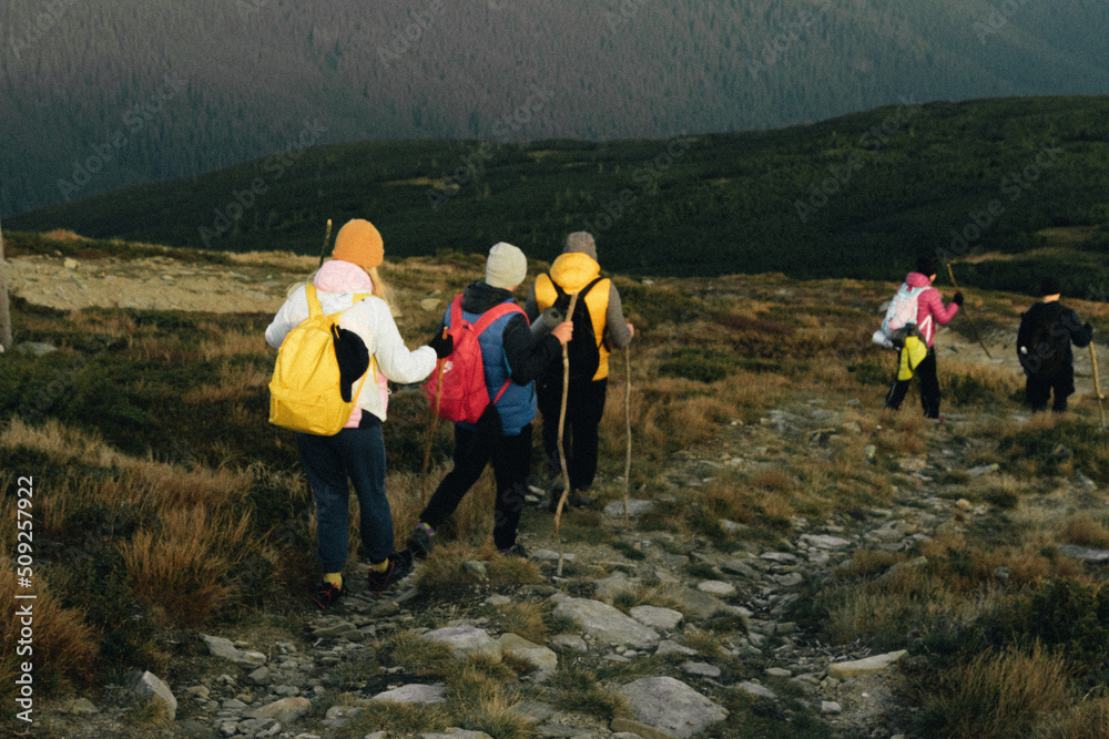 Column of tourists in the Carpathian mountains
