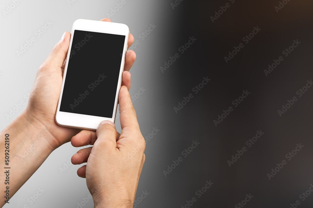 Technology Concept. Hand Using Mobile Phone with a blank screen Technology Concept. Hand Using Mobile Phone with a blank screen