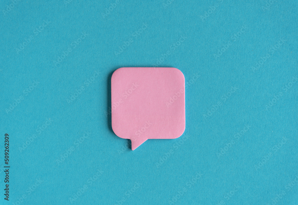 Pink sticker on blue paper background. Office stationery mockup. Back to school, communication minimalistic concept. Empty paper notes template for your logo, message Pink sticker on blue paper background. Office stationery mockup. Back to school, communication minimalistic concept. Empty paper notes template for your logo, message