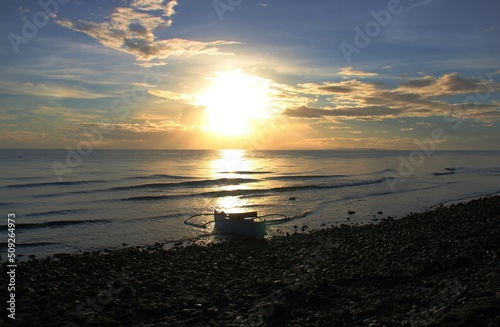 Boat in Sunrise in the beach, Sogod, Cebu, Philippines photo