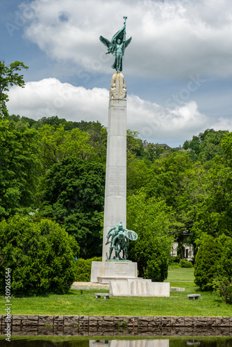 Montclair,NJ - USA - May 29, 2022 Closeup of the historic Memorial Obelisk at Edgemont Memorial Park. A tall obelisk with bronze sculptures of Winged Victory on top and the Billy Boys on the bottom.