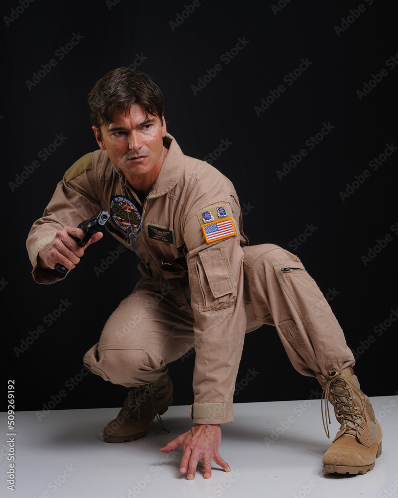The sexy military man poses for the photo.