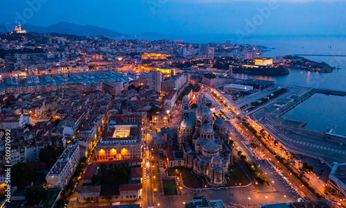 Bird's eye view of Marseille at dusk. Marseille Cathedral visible from above.