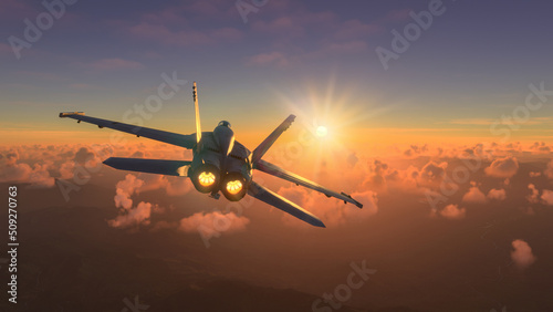 Militar aircraft flying over the clouds in amazing sunset photo