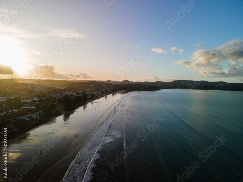 Sunset along Orewa beach on New Zealand's Hibiscus coast photo