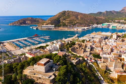 Picturesque summer view from drone of coastal Spanish town of Cartagena overlooking harbor with fleet of yachts © JackF