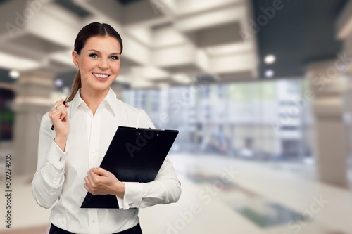 Wallpaper Mural Image of young woman, company worker, smiling , standing over background Torontodigital.ca