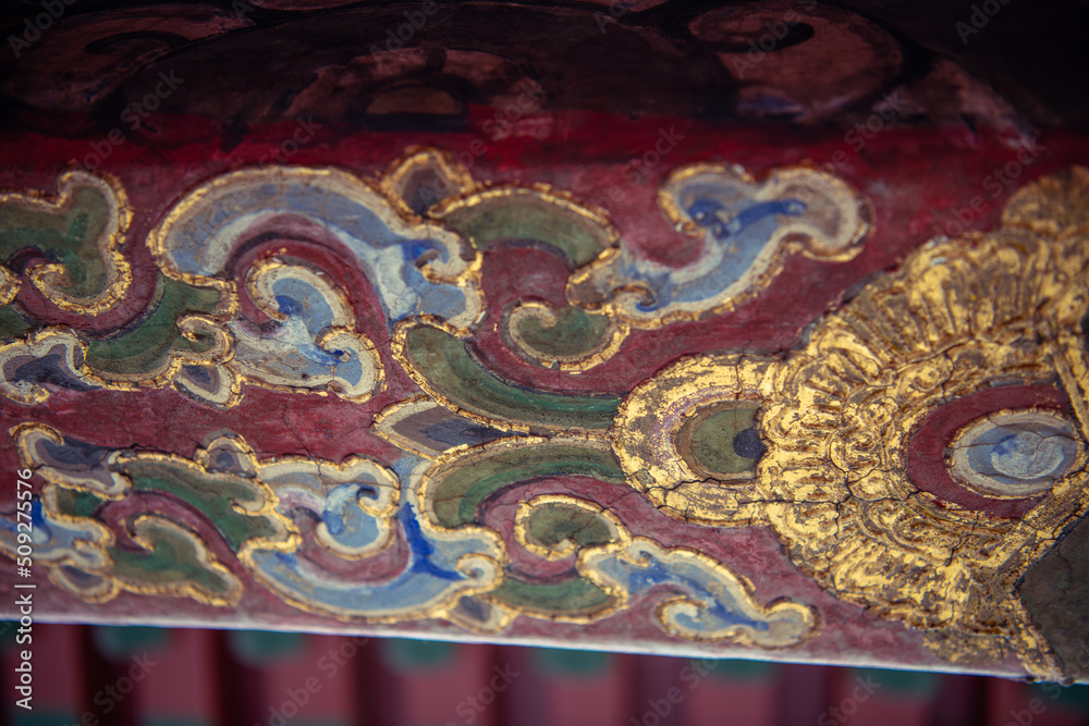 Background pattern of the woodwork on the Chinese temple, blue, golden, green paint