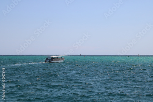 tourist boat sailing in the open ocean © Jessica