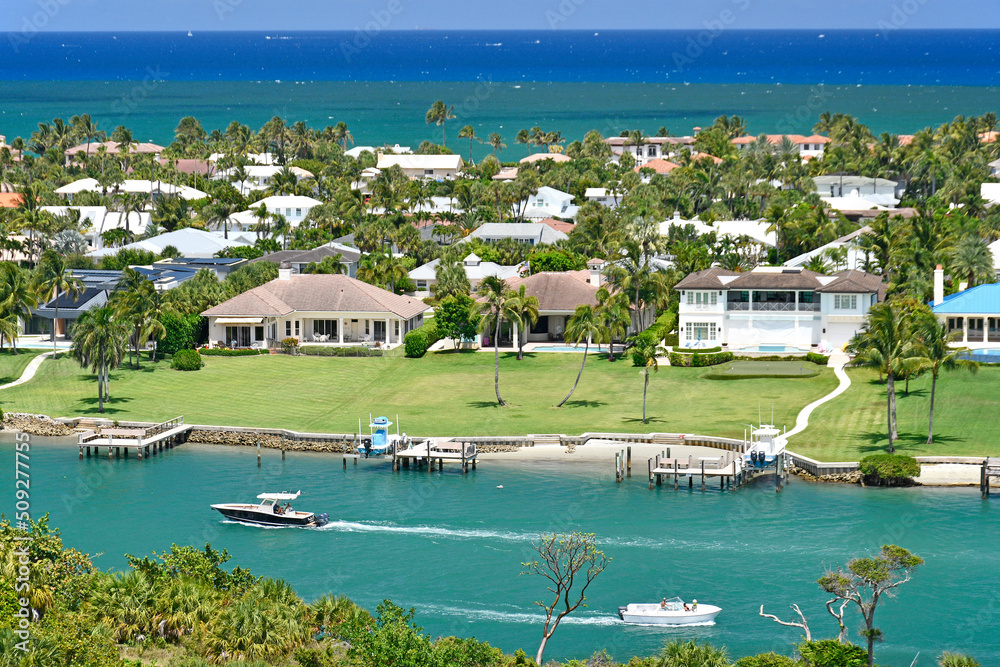 Aerial view of luxury waterfront homes along the intracoastal near Jupiter Inlet from the lighthouse in Jupiter, Florida in Palm Beach County - obrazy, fototapety, plakaty 
