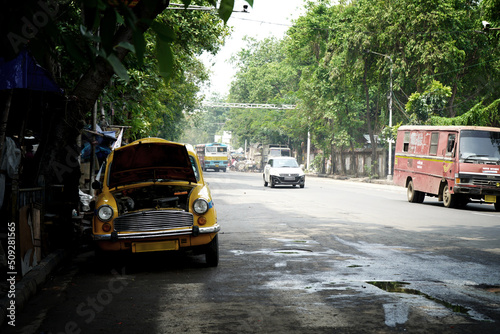 Kolkata Street and Yellow Taxi Waiting for Passenger