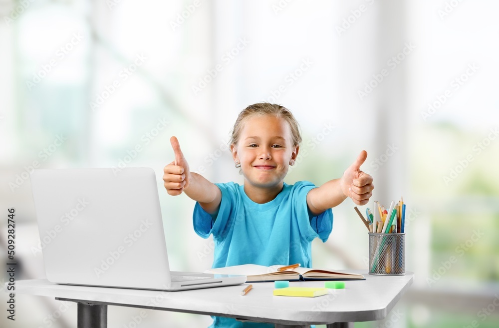 Distant Learning. Little child Showing Thumb Up While Study With Laptop At Home Distant Learning. Little child Showing Thumb Up While Study With Laptop At Home