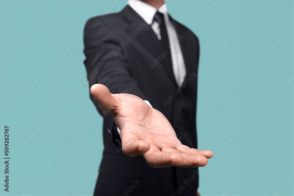 Hand of an unidentified man holding an invisible object. Concept of advertising goods and services. Concept infographic and conceptual advertising. Hand of an unidentified man holding an invisible object. Concept of advertising goods and services. Concept infographic and conceptual advertising.