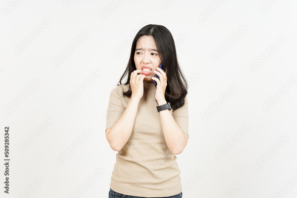 Talking on smartphone and get worry and afraid Of Beautiful Asian Woman Isolated On White Background Talking on smartphone and get worry and afraid Of Beautiful Asian Woman Isolated On White Background