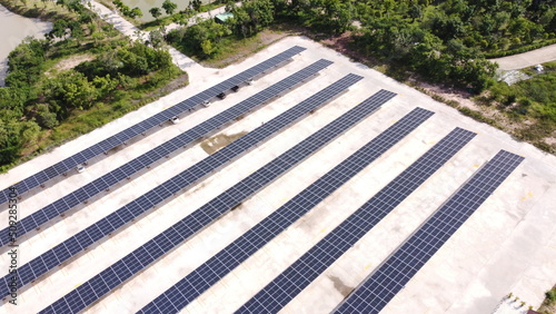 Aerial view of a solar farm producing clean renewable sun energy, industrial landscape
