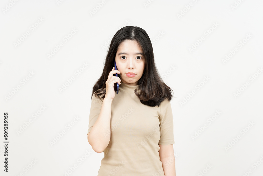 Talking on smartphone and get angry Of Beautiful Asian Woman Isolated On White Background Talking on smartphone and get angry Of Beautiful Asian Woman Isolated On White Background
