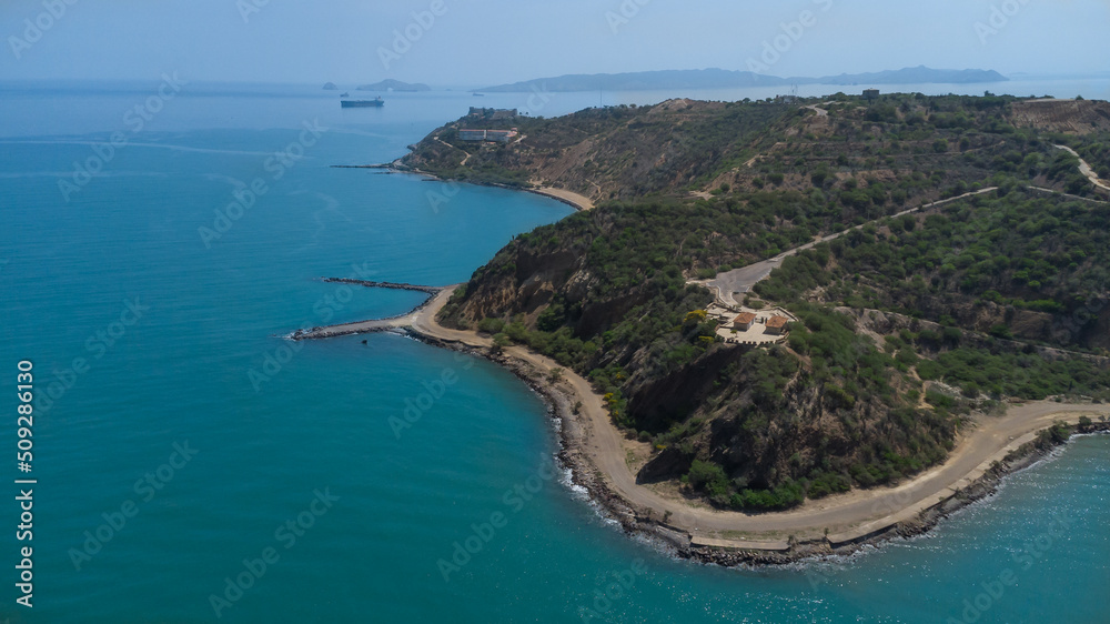 Fototapeta premium Drone photos of El Morro hill, recorded in the middle of a sunny morning, in the videos you can see, El Morro hill, hills, mountains, coasts, roads, trees on the shore of the beach, beach, rocks, sand