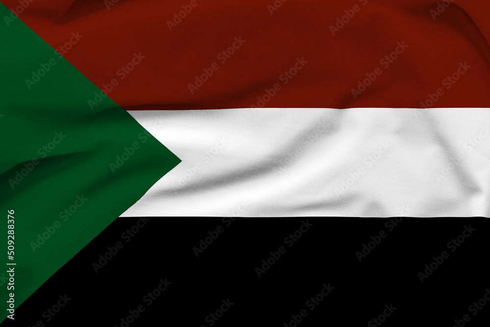 Sudan national flag, folds and hard shadows on the canvas