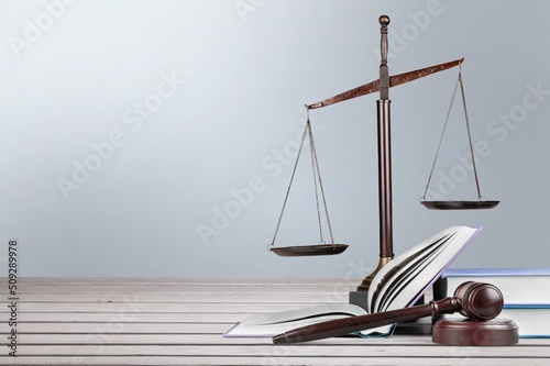 Judge gavel on law books in court, law and justice concept.