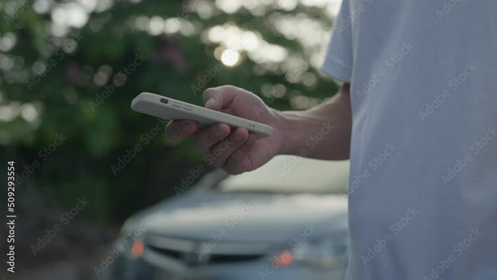 Man use mobile phone inform for emergency car through a mobile application system. It is important to check the condition of the car before traveling. car insurance concept. Man use mobile phone inform for emergency car through a mobile application system. It is important to check the condition of the car before traveling. car insurance concept.