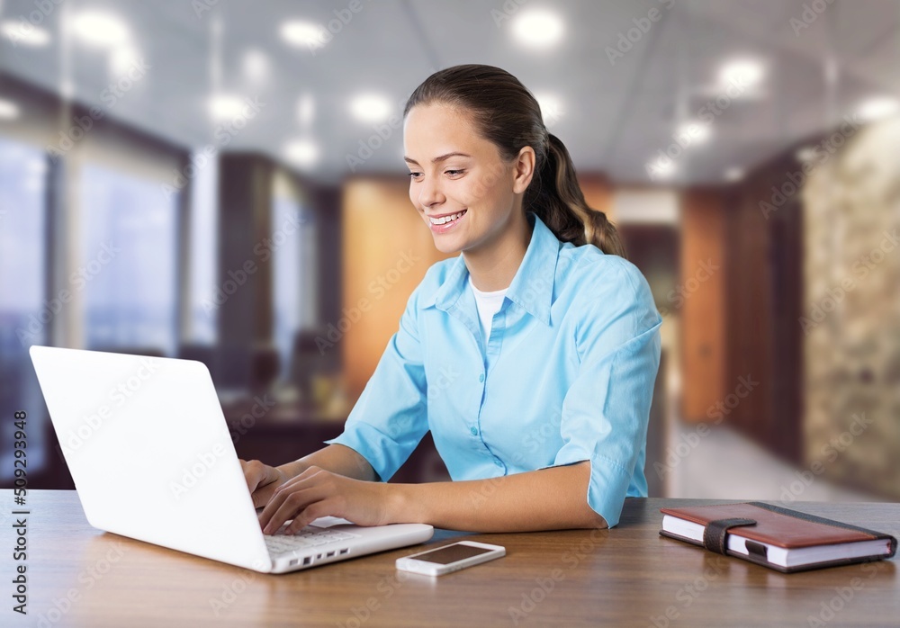 A portrait of attractive focused girl technician texting using device A portrait of attractive focused girl technician texting using device