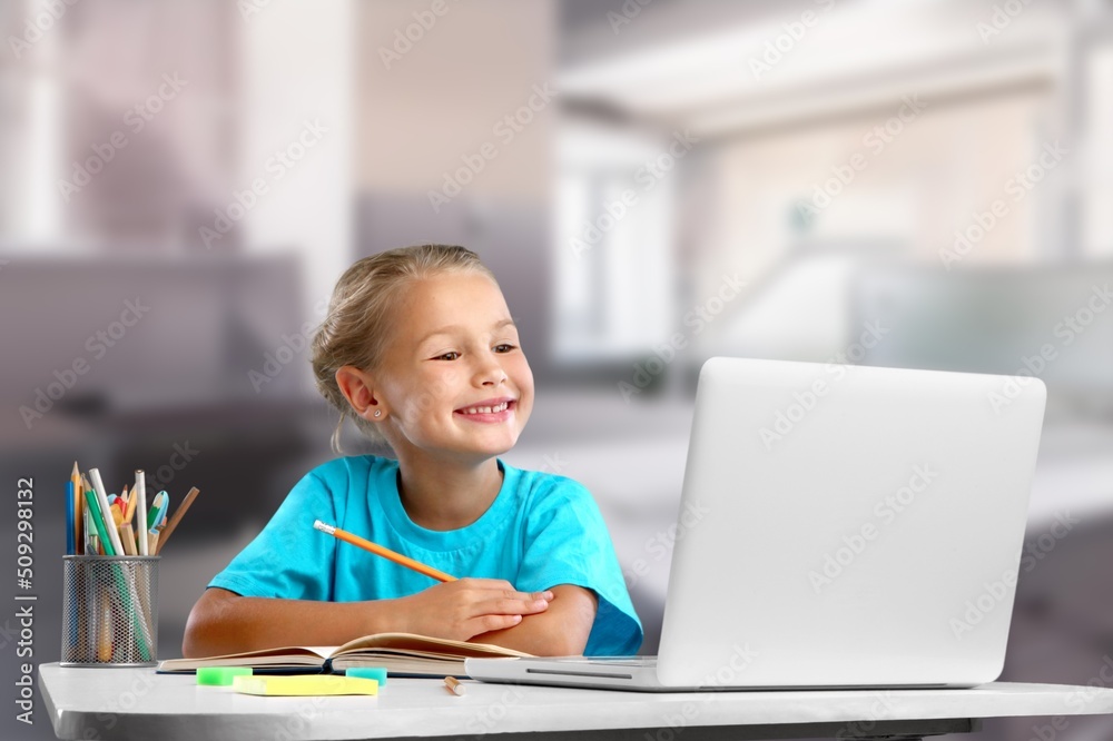 Portrait of smiling child studying at home, homeschooling concept Portrait of smiling child studying at home, homeschooling concept