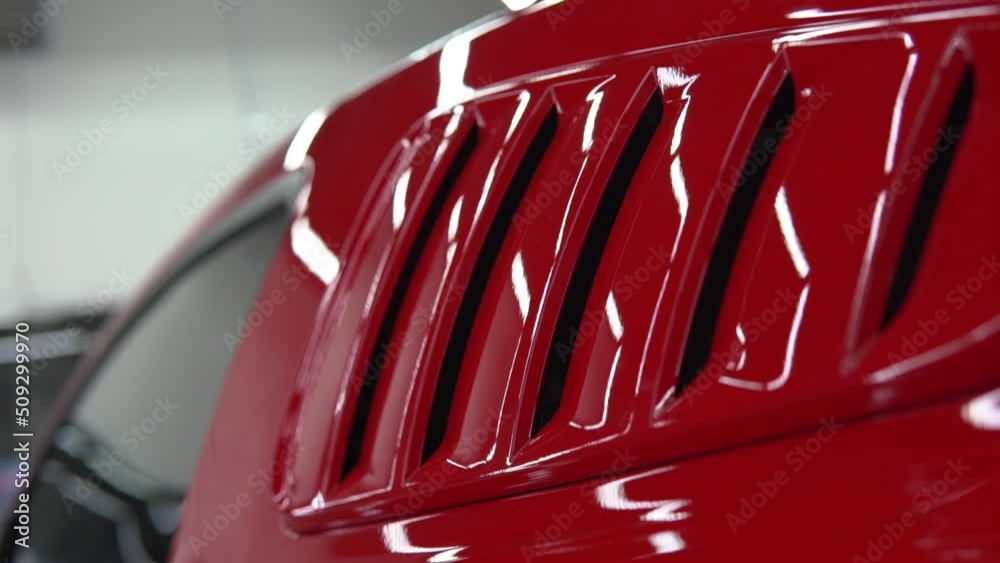 Red, luxury, sport, muscle car body detail. Racing automobile shiny hull side pan.