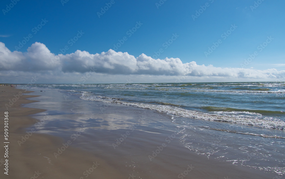 Seascape of the Baltic Sea. Clouds divided the sky.