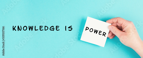 The phrase knowledge is power is standing on a paper, coaching and education concept, development of personal potential, cognition and willpower