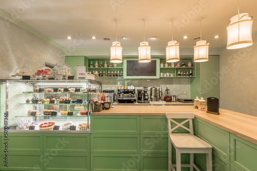 Cuadro en lienzo Interior of coffeehouse in Provence style with counter and glass showcase with s