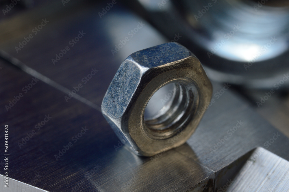Accurate measuring tool caliper and metal ruler lie in place with nuts. close-up. Accurate measuring tool caliper and metal ruler lie in place with nuts. close-up.