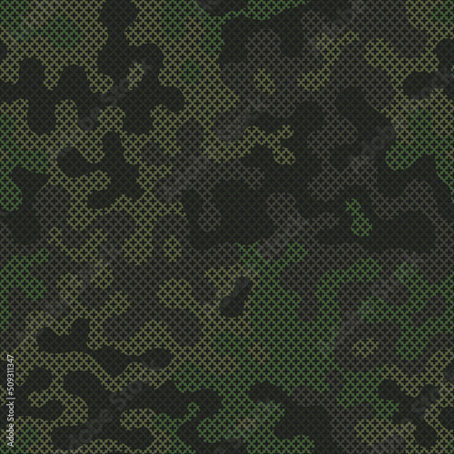Green cross stitch camouflage seamless pattern for your design. Fashionable emerald color knit fabric texture. Vector crochet camo background